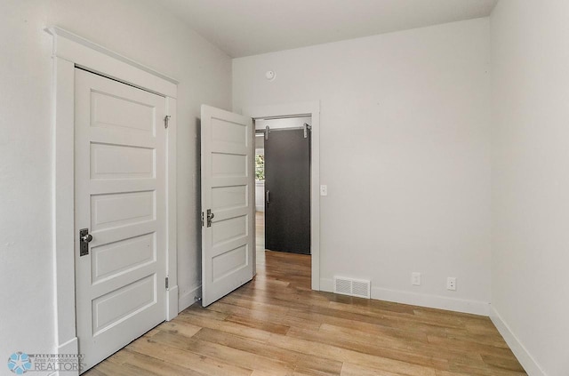 1036 12th St N, Fargo, ND 58102 - spare room featuring light wood finished floors and baseboards