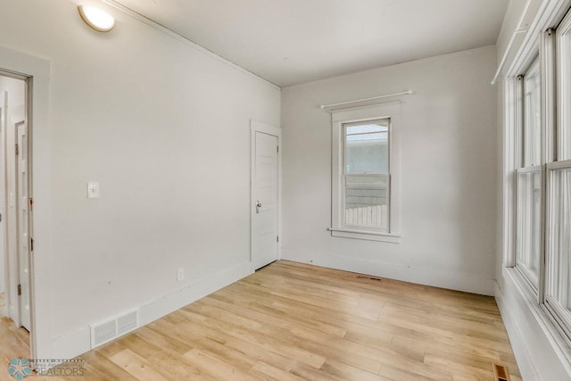1036 12th St N, Fargo, ND 58102 - spare room featuring light wood-style flooring and baseboards