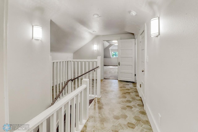 1036 12th St N, Fargo, ND 58102 - hall featuring an upstairs landing, lofted ceiling, and baseboards