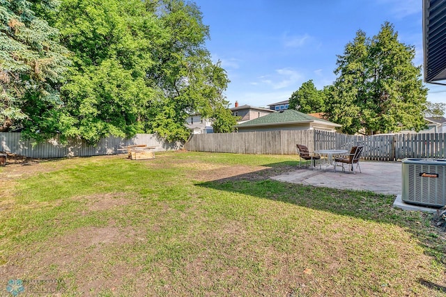1036 12th St N, Fargo, ND 58102 - view of yard featuring cooling unit, a patio area, and a fire pit