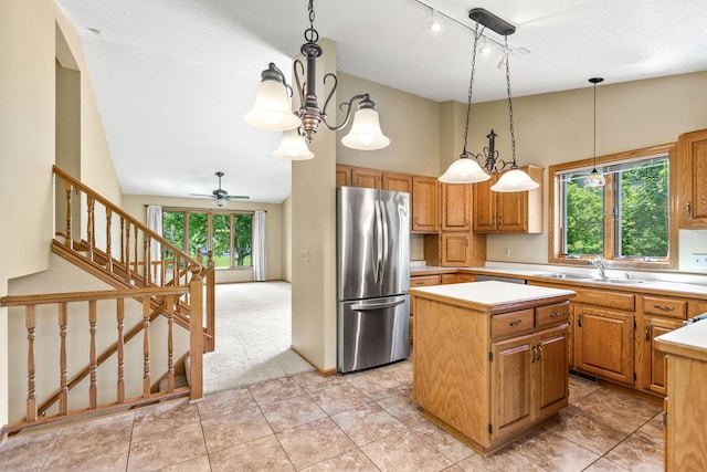 6260 Wessel Ct, Eden Prairie, MN 55346 - kitchen with freestanding refrigerator, a center island, light countertops, a sink, and light carpet