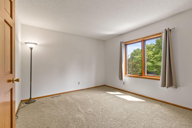 6260 Wessel Ct, Eden Prairie, MN 55346 - carpeted spare room with baseboards and a textured ceiling