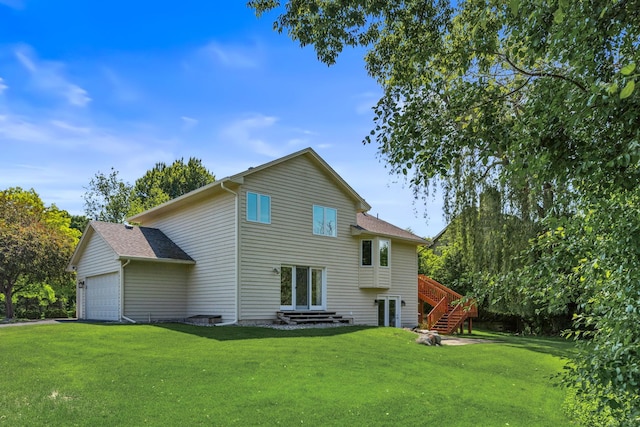 6260 Wessel Ct, Eden Prairie, MN 55346 - back of house with a lawn, a garage, and roof with shingles
