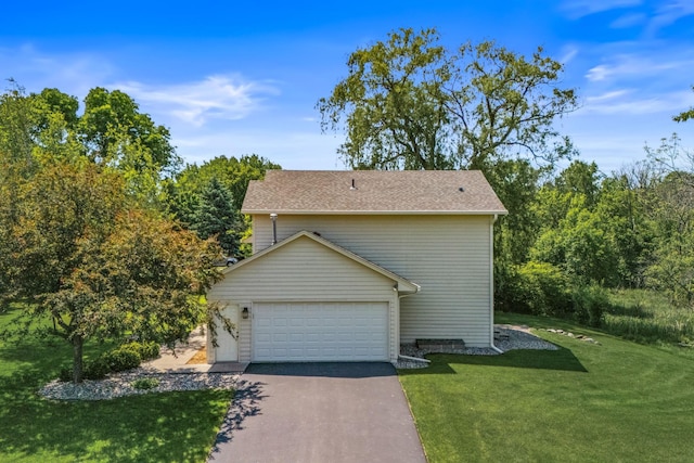 6260 Wessel Ct, Eden Prairie, MN 55346 - view of side of home with a lawn, asphalt driveway, and an attached garage