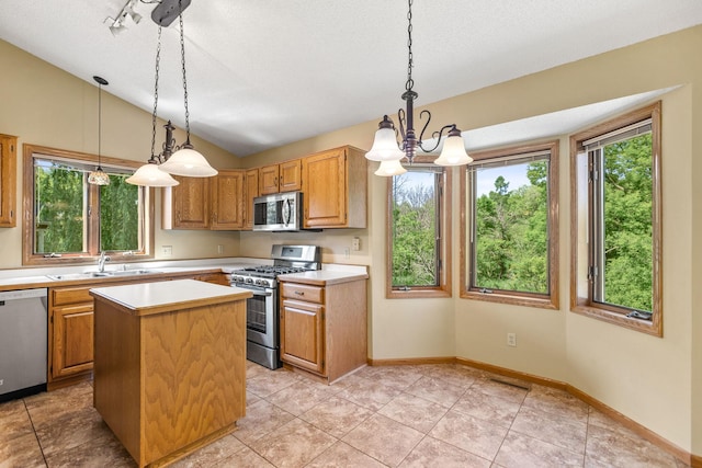 6260 Wessel Ct, Eden Prairie, MN 55346 - kitchen with stainless steel appliances, light countertops, vaulted ceiling, a chandelier, and a kitchen island