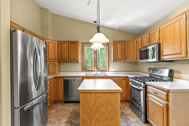 6260 Wessel Ct, Eden Prairie, MN 55346 - kitchen featuring appliances with stainless steel finishes, lofted ceiling, light countertops, a center island, and decorative light fixtures