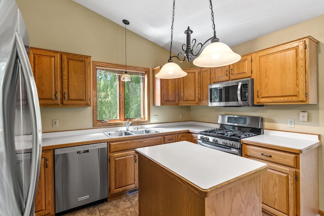 6260 Wessel Ct, Eden Prairie, MN 55346 - kitchen with stainless steel appliances, light countertops, vaulted ceiling, a kitchen island, and decorative light fixtures