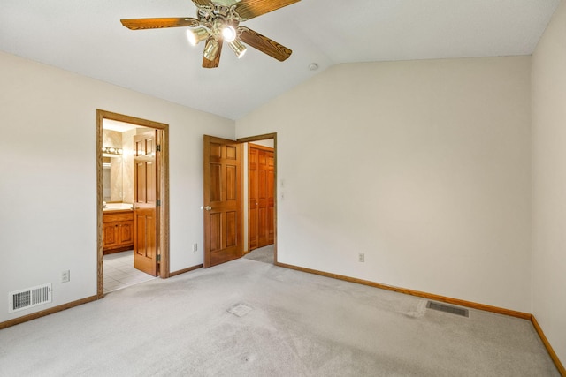 6260 Wessel Ct, Eden Prairie, MN 55346 - unfurnished bedroom featuring lofted ceiling, light carpet, ensuite bathroom, and ceiling fan
