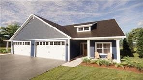 414 Ford St E, Northfield, MN 55057 - view of front facade with a garage and driveway