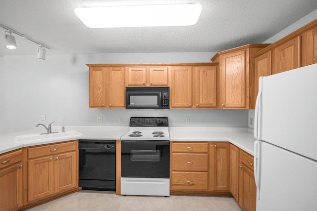 12496 43rd St NE, Saint Michael, MN 55376 - kitchen featuring black appliances, a sink, a textured ceiling, light countertops, and rail lighting