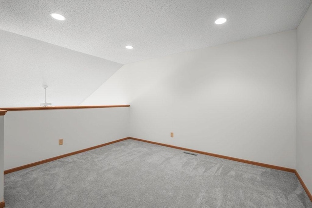 12496 43rd St NE, Saint Michael, MN 55376 - carpeted empty room with recessed lighting, baseboards, a textured ceiling, and vaulted ceiling