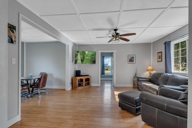 37454 605th Ave, Bluffton Twp, MN 56518 - living room featuring a ceiling fan, light wood-style floors, and baseboards