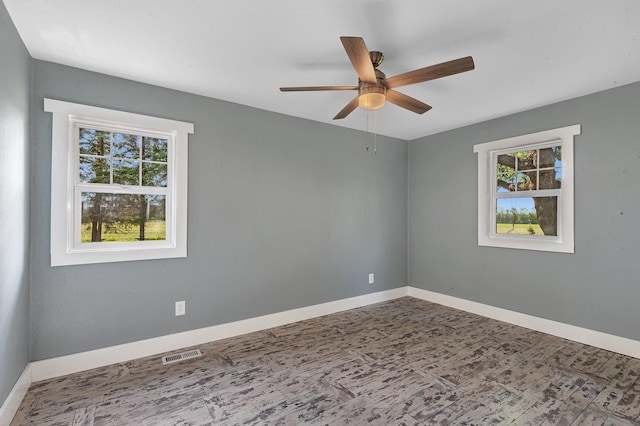 37454 605th Ave, Bluffton Twp, MN 56518 - empty room featuring ceiling fan and baseboards
