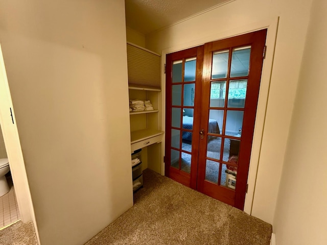 30055 Shore Dr, Pengilly, MN 55775 - hallway with french doors and carpet