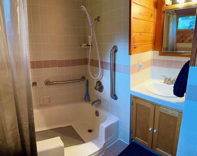30055 Shore Dr, Pengilly, MN 55775 - full bathroom with backsplash, shower / bath combo, tile patterned flooring, and vanity