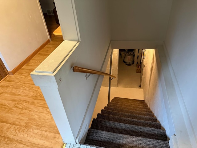 30055 Shore Dr, Pengilly, MN 55775 - stairway with wood finished floors and baseboards