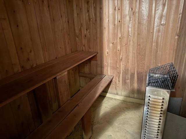 30055 Shore Dr, Pengilly, MN 55775 - relaxing sauna featuring wood walls and unfinished concrete floors