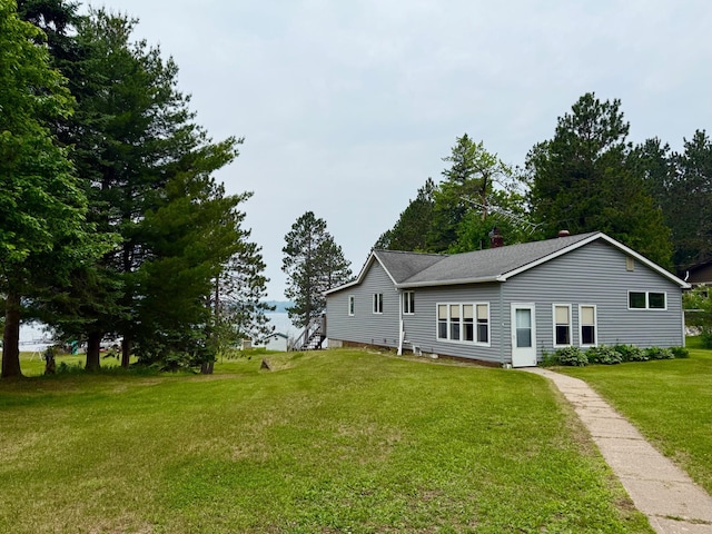 30055 Shore Dr, Pengilly, MN 55775 - view of front of home featuring a front lawn and roof with shingles