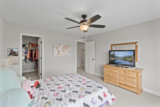 5945 178th St W, Lakeville, MN 55044 - carpeted bedroom featuring a walk in closet, baseboards, a closet, and ceiling fan