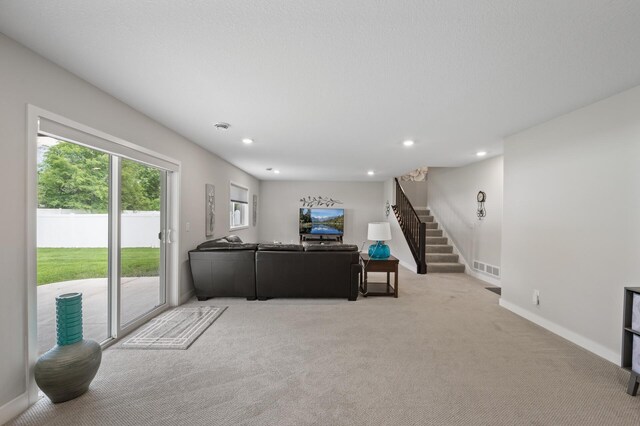 5945 178th St W, Lakeville, MN 55044 - living area with light colored carpet, stairway, recessed lighting, and baseboards