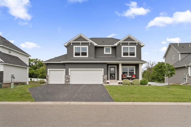5945 178th St W, Lakeville, MN 55044 - craftsman-style house featuring driveway, a front lawn, stone siding, and a porch