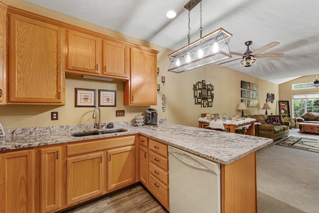 513 2nd Ave SW, Lonsdale, MN 55046 - kitchen with dishwasher, a sink, vaulted ceiling, a ceiling fan, and a peninsula
