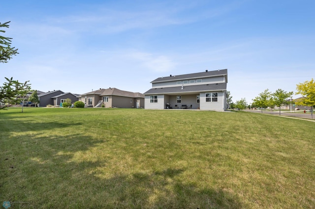 2200 39th St S, Moorhead, MN 56560 - rear view of property featuring a lawn