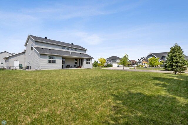 2200 39th St S, Moorhead, MN 56560 - back of property with a yard, a patio, and a residential view