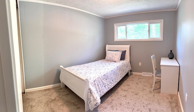 604 10th Ave, Grand Rapids, MN 55744 - bedroom with carpet flooring, a textured ceiling, and ornamental molding
