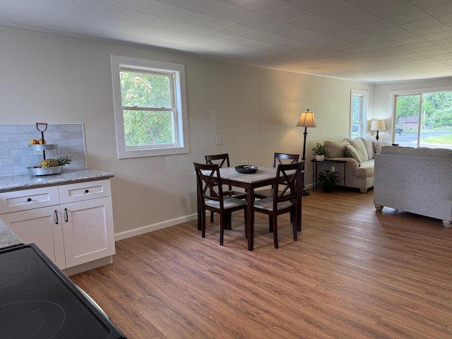 604 10th Ave, Grand Rapids, MN 55744 - dining space featuring light wood-type flooring and ornamental molding