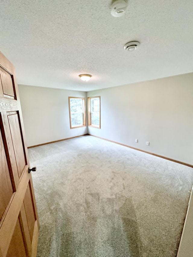 1855 Pioneer Ln Unit 1855, Centerville, MN 55038 - carpeted spare room featuring a smoke detector and a textured ceiling
