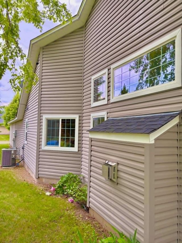1855 Pioneer Ln Unit 1855, Centerville, MN 55038 - view of property exterior featuring a central AC unit and a yard