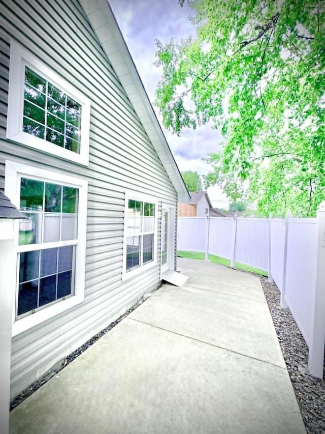 1855 Pioneer Ln Unit 1855, Centerville, MN 55038 - fenced backyard featuring a patio