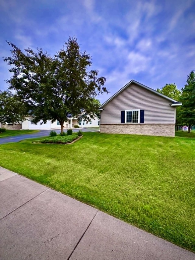 1855 Pioneer Ln Unit 1855, Centerville, MN 55038 - view of property exterior featuring a yard and stone siding