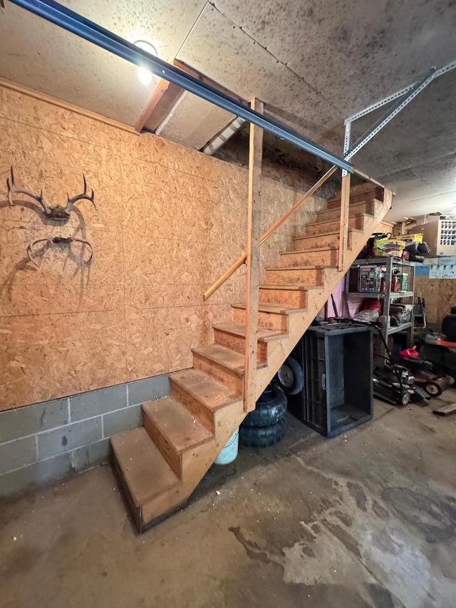 27315 Stark Lake Rd, Aitkin, MN 56431 - basement featuring stairs and concrete block wall