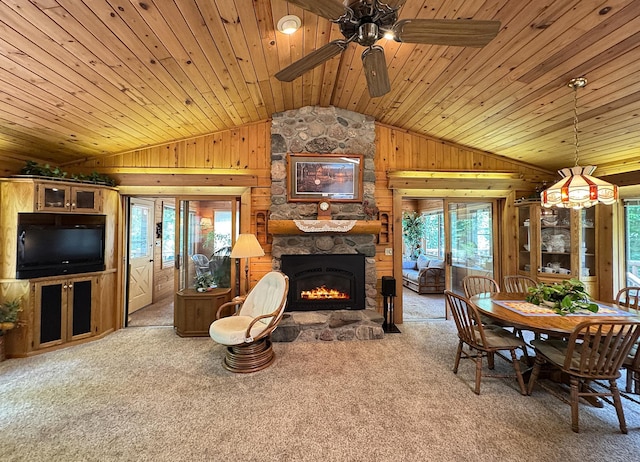 27315 Stark Lake Rd, Aitkin, MN 56431 - living room featuring lofted ceiling, wooden walls, plenty of natural light, carpet, and wooden ceiling