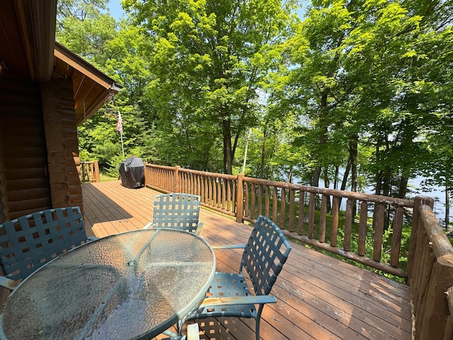 27315 Stark Lake Rd, Aitkin, MN 56431 - deck with outdoor dining area and a grill