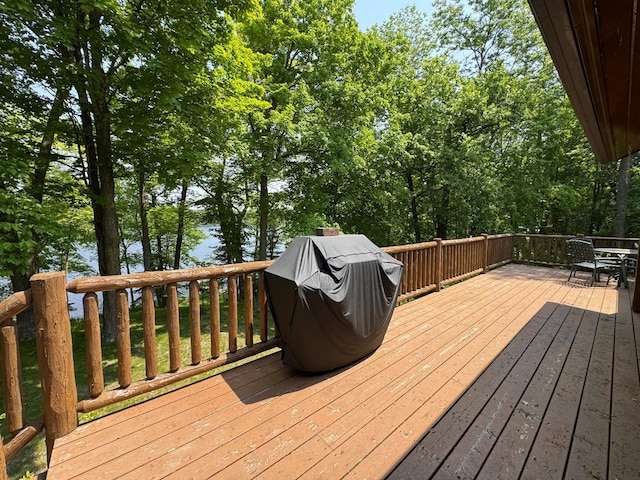 27315 Stark Lake Rd, Aitkin, MN 56431 - deck featuring grilling area, a water view, and outdoor dining area