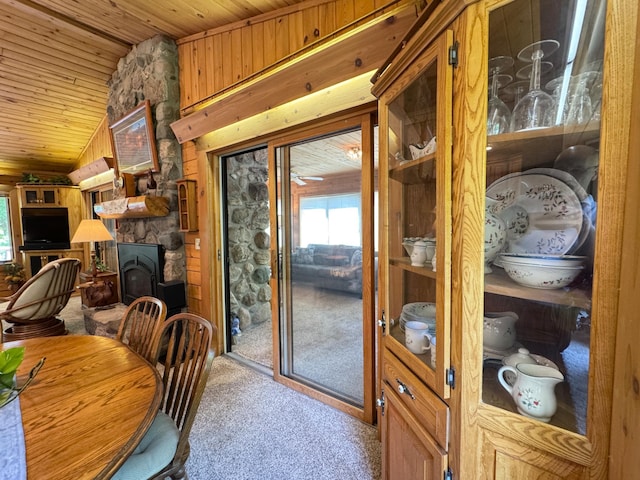27315 Stark Lake Rd, Aitkin, MN 56431 - dining room with wooden ceiling, carpet flooring, lofted ceiling, and wood walls
