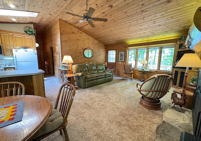 27315 Stark Lake Rd, Aitkin, MN 56431 - living area featuring vaulted ceiling, wood ceiling, wood walls, a ceiling fan, and light carpet