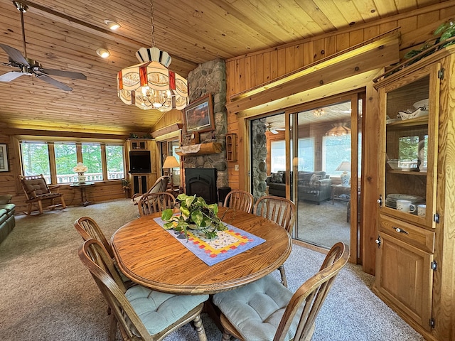 27315 Stark Lake Rd, Aitkin, MN 56431 - dining room featuring carpet flooring, wooden ceiling, wooden walls, lofted ceiling, and ceiling fan
