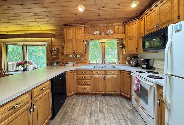 27315 Stark Lake Rd, Aitkin, MN 56431 - kitchen with black appliances, wooden ceiling, light wood-style floors, brown cabinets, and light countertops