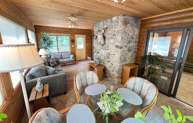 27315 Stark Lake Rd, Aitkin, MN 56431 - carpeted living room with wood ceiling, ceiling fan, and wood walls