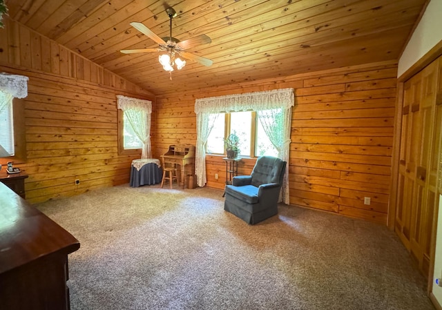 27315 Stark Lake Rd, Aitkin, MN 56431 - sitting room featuring lofted ceiling, ceiling fan, wood ceiling, wooden walls, and carpet floors