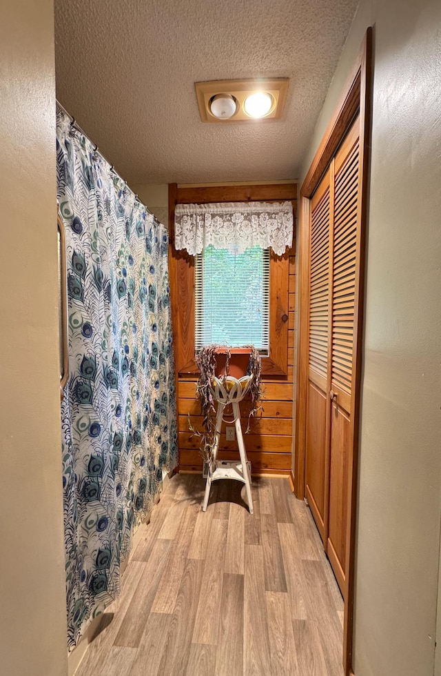 27315 Stark Lake Rd, Aitkin, MN 56431 - bathroom featuring wood finished floors and a textured ceiling