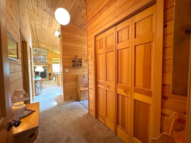 27315 Stark Lake Rd, Aitkin, MN 56431 - hallway with vaulted ceiling, carpet, wood walls, and wooden ceiling