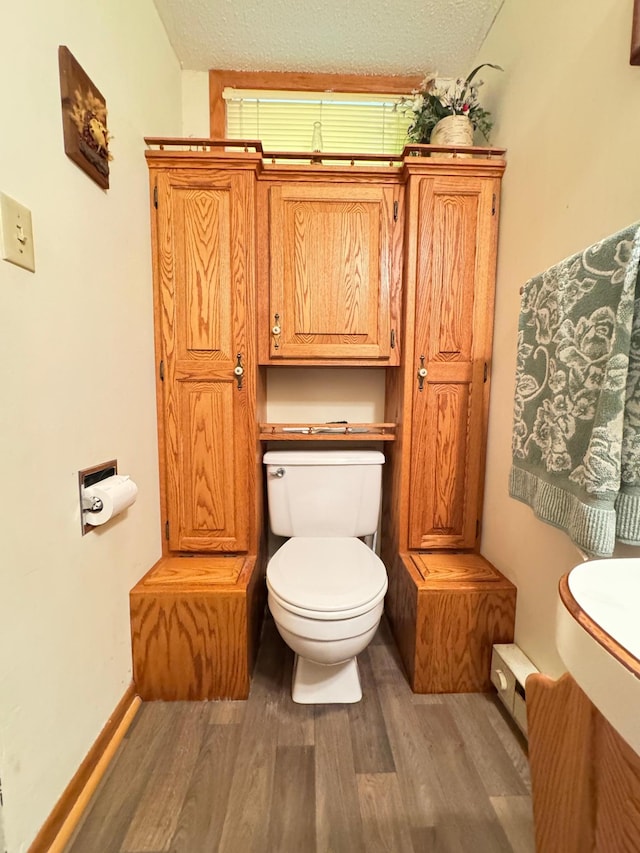 27315 Stark Lake Rd, Aitkin, MN 56431 - half bath featuring wood finished floors and a textured ceiling