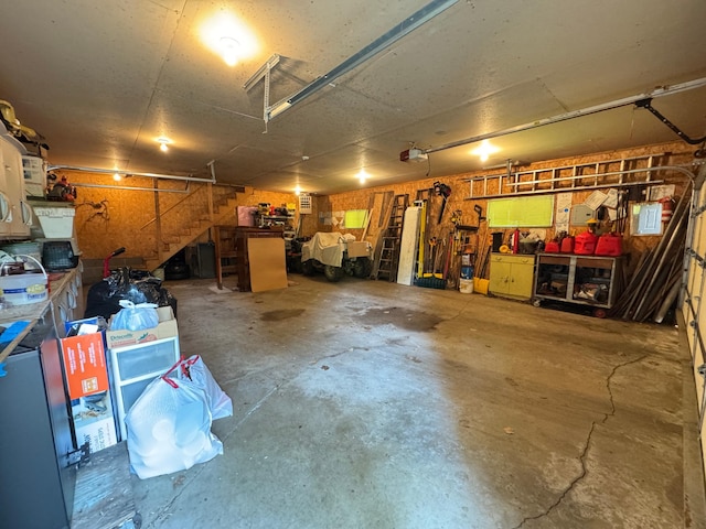 27315 Stark Lake Rd, Aitkin, MN 56431 - garage featuring a workshop area and a garage door opener