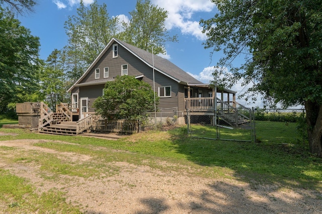 43867 County Road 15, New Sweden Twp, MN 56074 - back of property featuring stairs, a wooden deck, and a gate