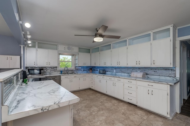 43867 County Road 15, New Sweden Twp, MN 56074 - kitchen featuring decorative backsplash, stainless steel microwave, a ceiling fan, and white cabinets